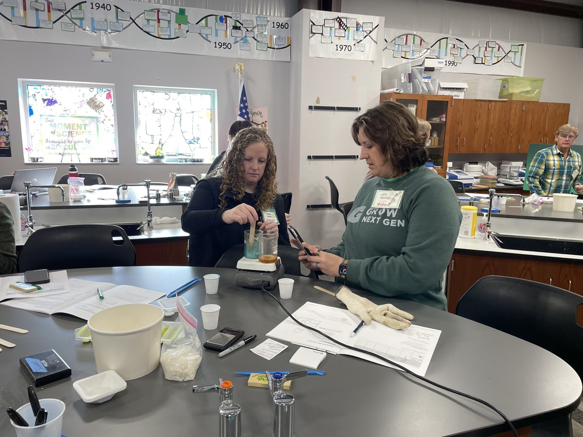 Katy Wright implements hands-on science labs from GrowNextGen at an immersive teacher workshop integrating industry with classroom concepts.